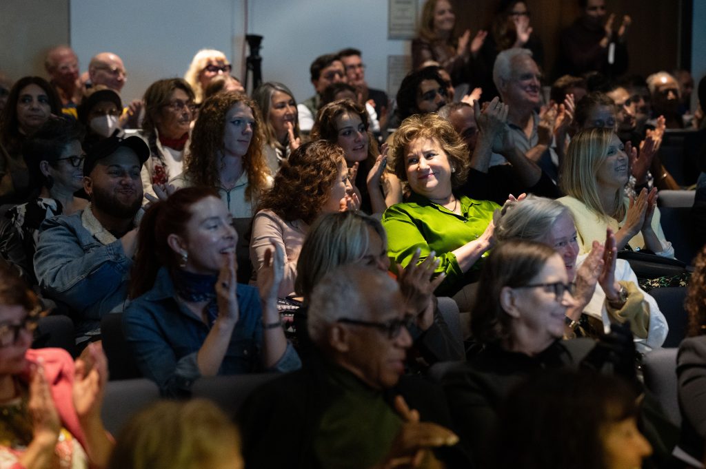 NYU Audience applauding Giannina Braschi's launch of Putinoika